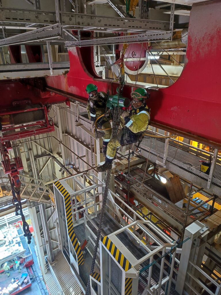BTS rope access technicians working inside a drilling rig structure