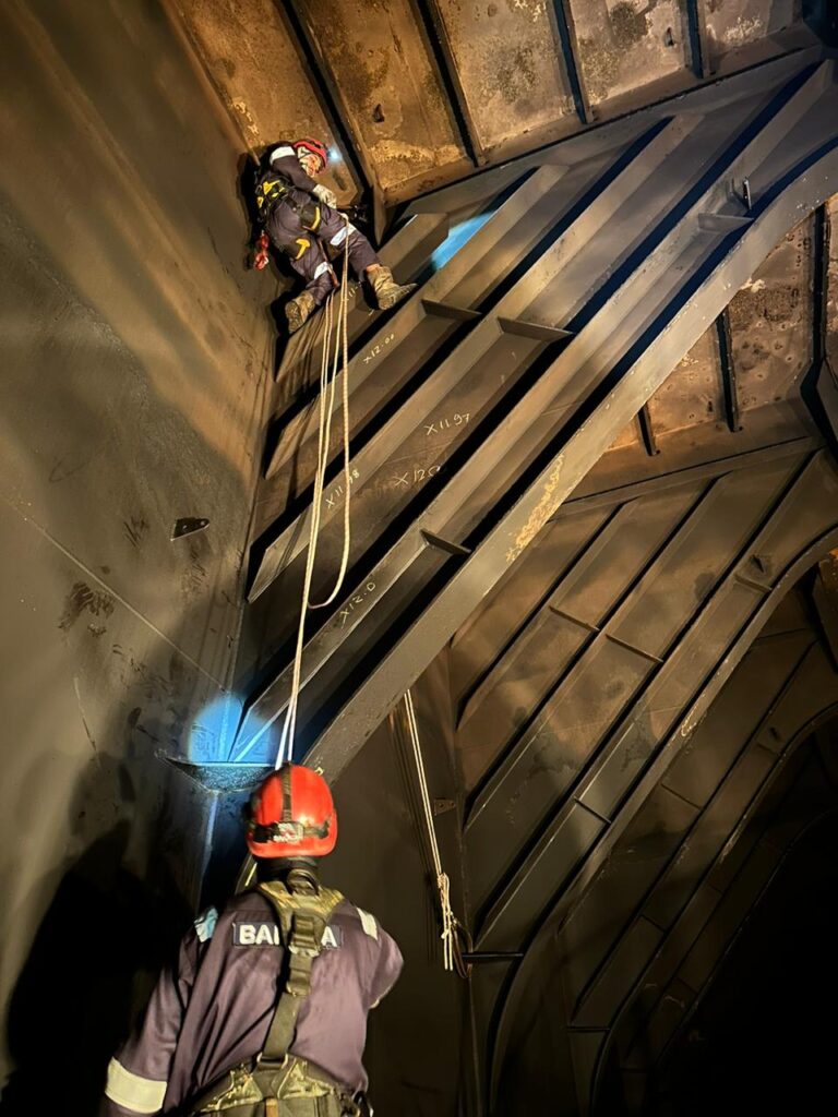 BTS rope access technicians working inside a steel tank